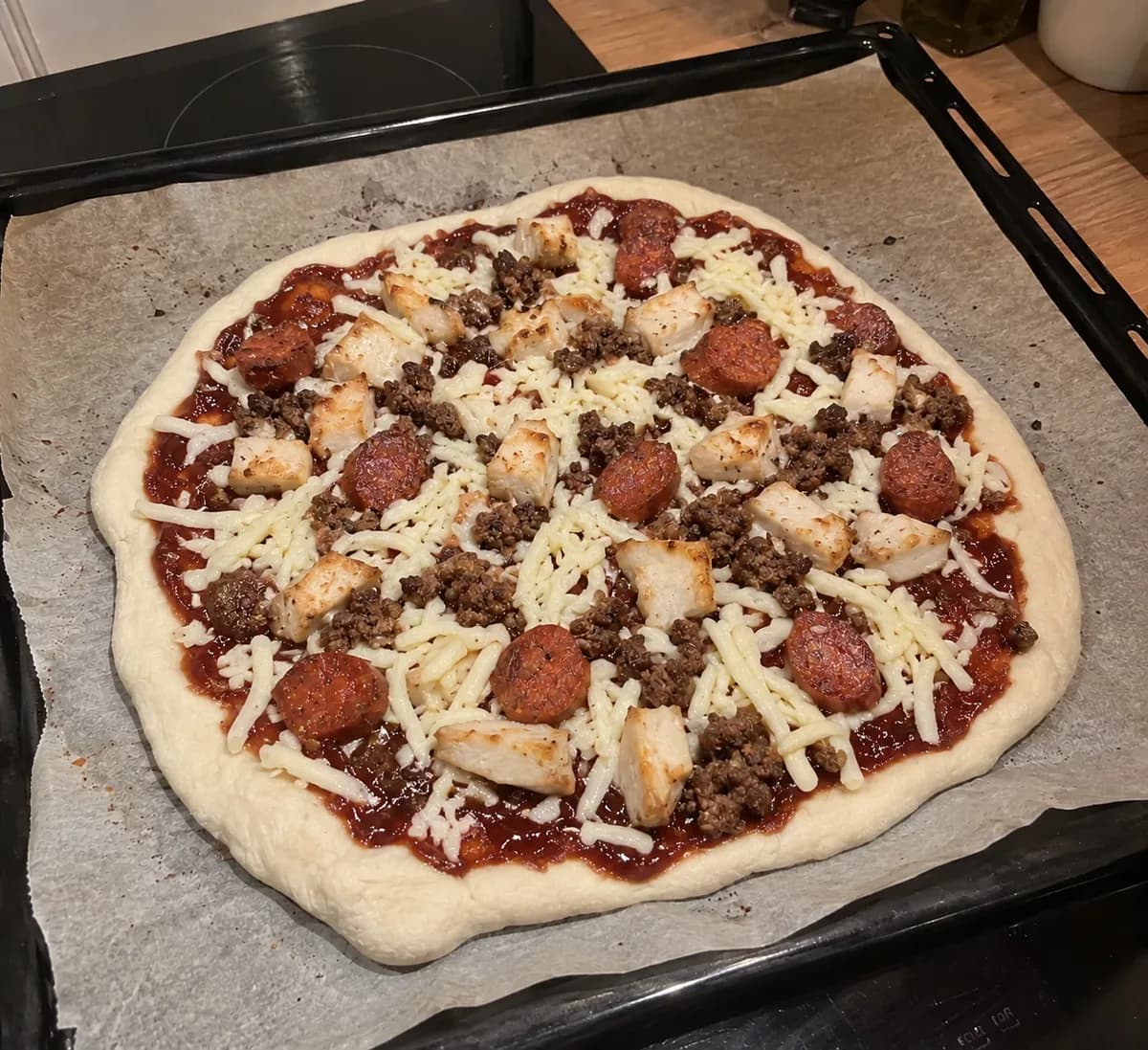BBQ with Chicken, Merguez and Beef before baking